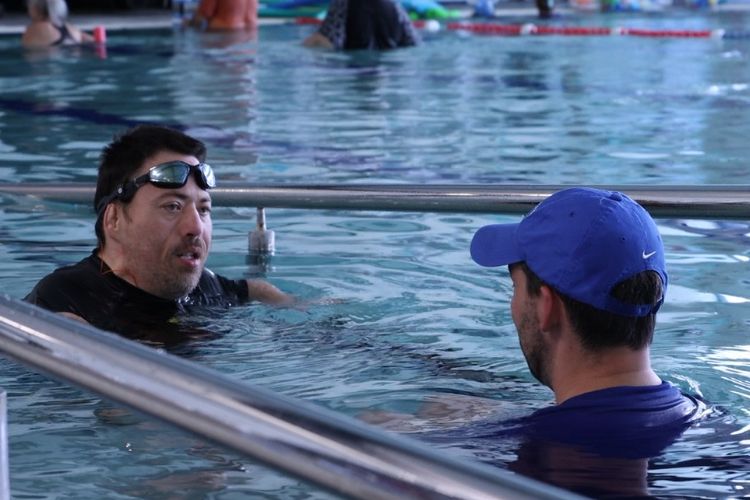  Mark, a 41-year-old man from North Brisbane, engaging in hydrotherapy in a pool