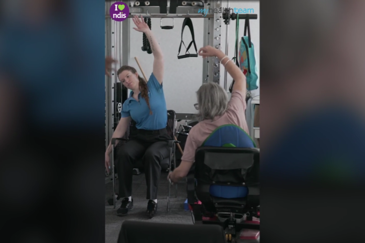 Two women in wheelchairs engaging in physical therapy at a healthcare facility. The image represents the personalised, supportive care provided by My Health Team in Redcliffe to individuals with chronic diseases and disabilities to improve their health and quality of life.