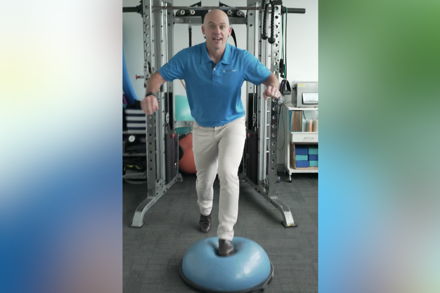 Health professional demonstrating the importance of balance by stepping into a Bosu Ball and not falling to show his balancing skills.