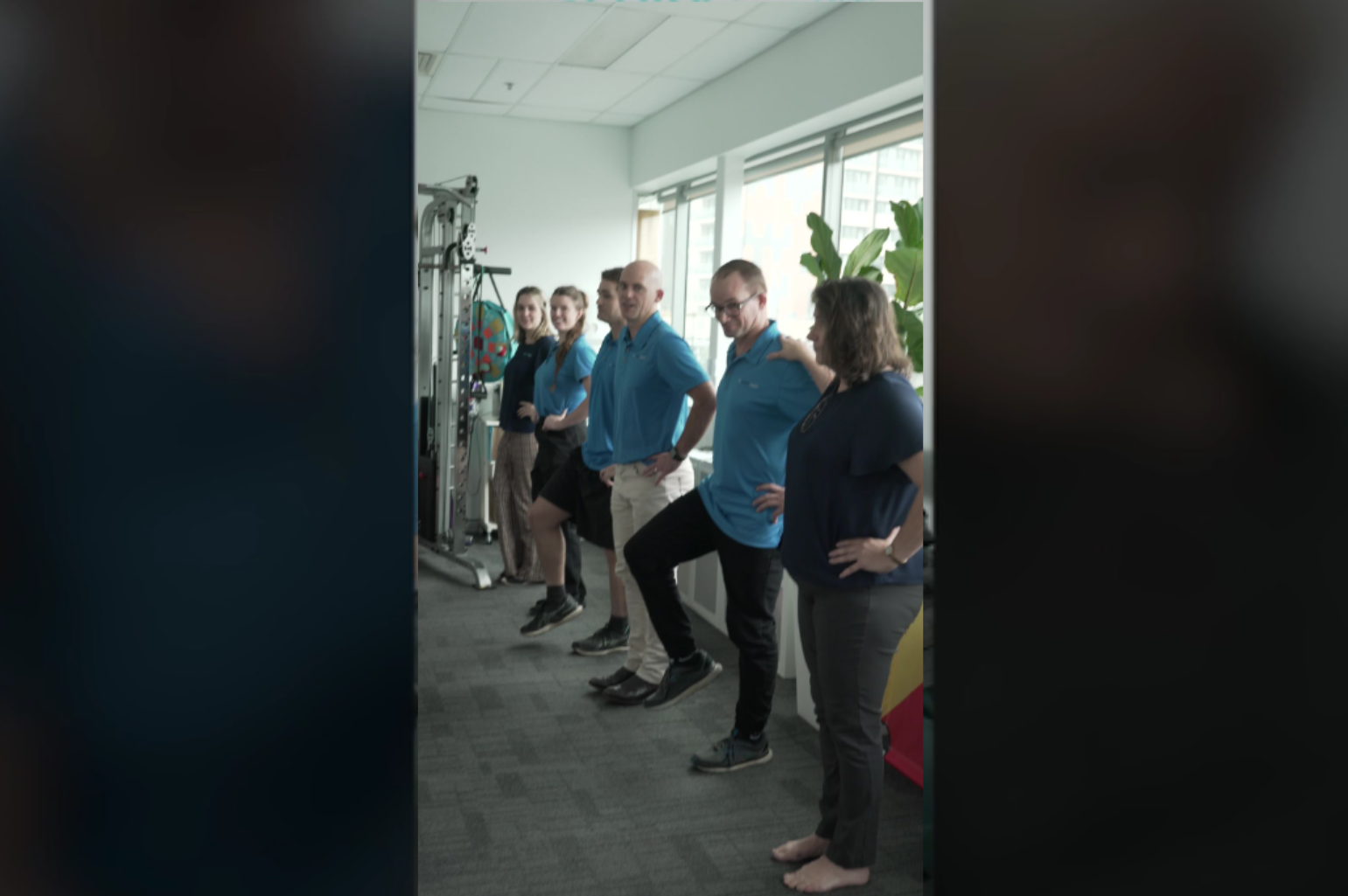 Health practitioners trying to balance using one foot at My Health Team in Redcliffe.